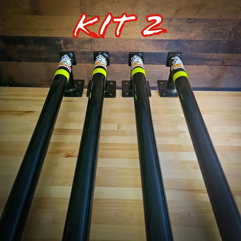 A set of four poles on top of a wooden floor.