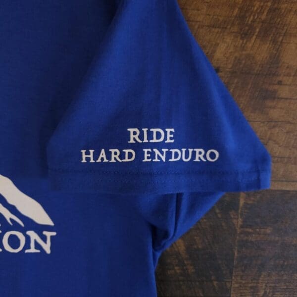 A close up of the words ride hard enduro on a t shirt