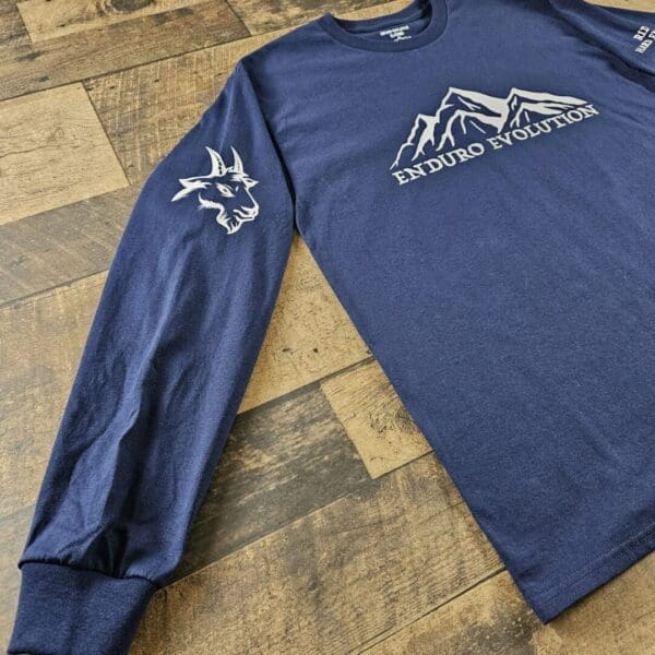A long sleeve shirt with the words " north dakota " on it.