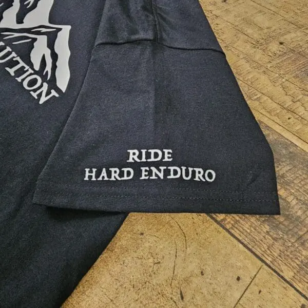 A black towel with the words " ride hard enduro " written on it.