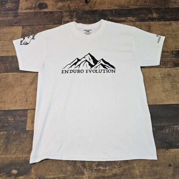 A white t-shirt with an image of mountains on it.