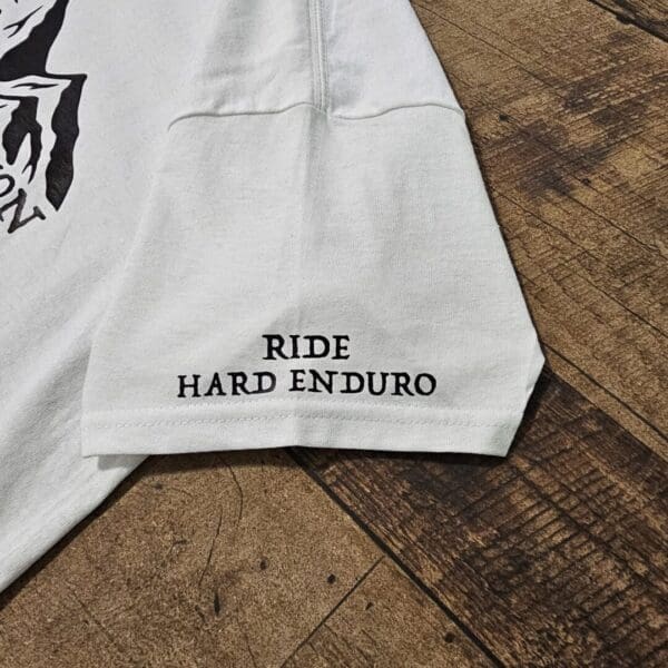 A close up of the words ride hard enduro on a t shirt