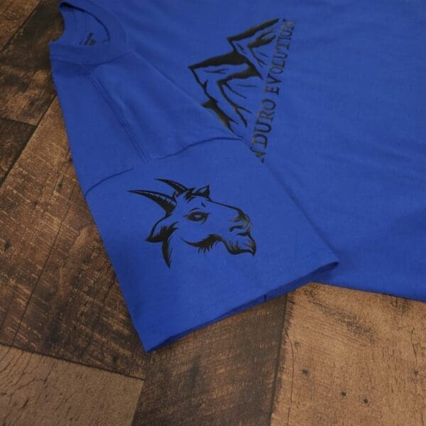 A blue shirt with black writing on it
