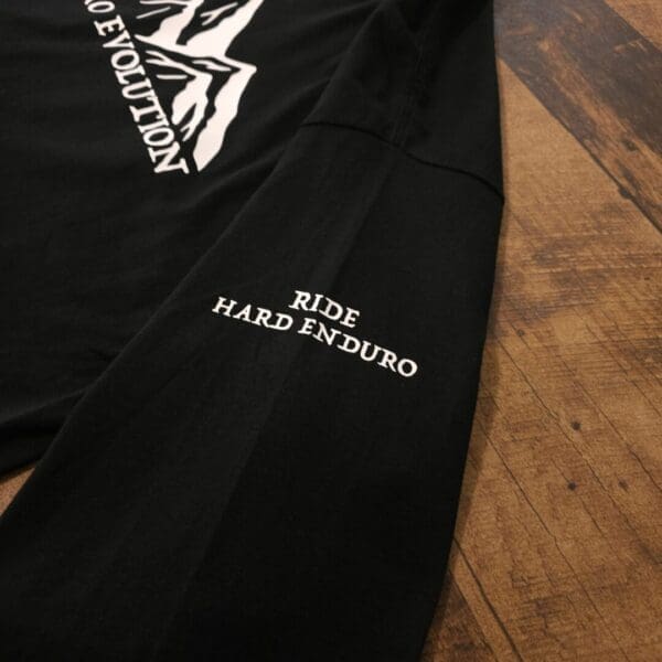A close up of the side of a pair of black pants