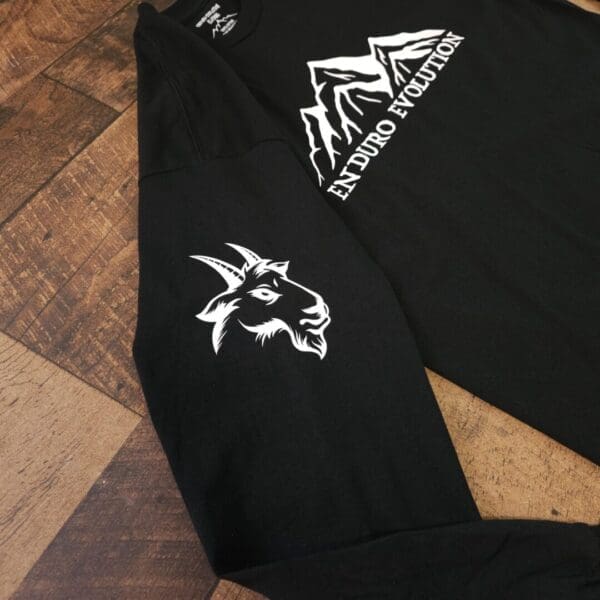 A black shirt with a goat on it