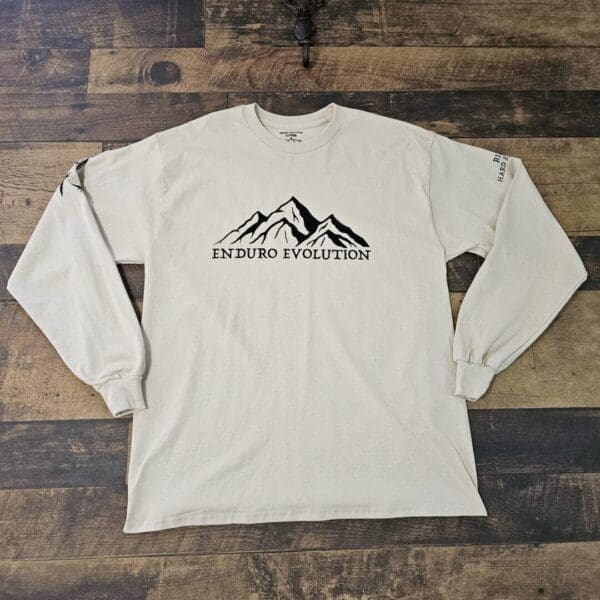 A long sleeve t-shirt with the words " mountain expeditions " on it.