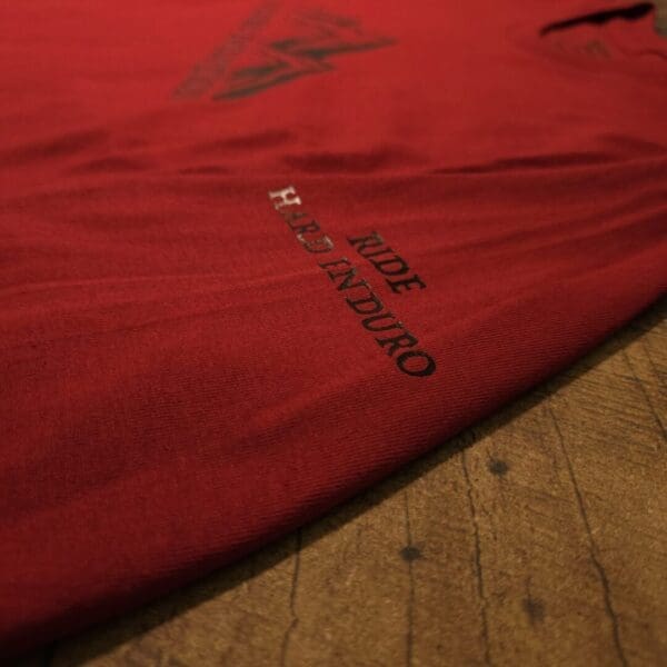 A red blanket with the words " surf and sun ".