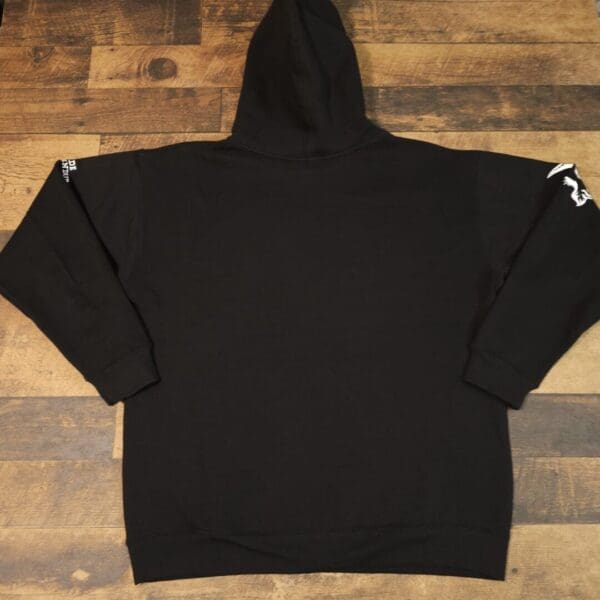 A black hoodie with white writing on it.