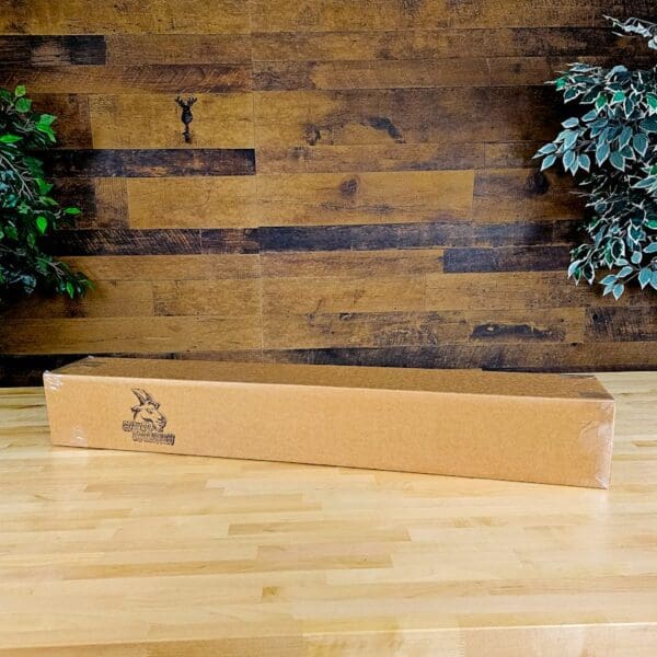 A box sitting on top of a hard wood floor.
