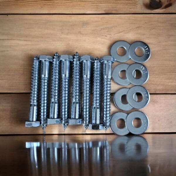 A number of nuts and bolts on top of a table